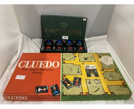 A WADDINGTONS CLUEDO BOARD GAME AND A BOXED SET OF CARPET BOWLS 