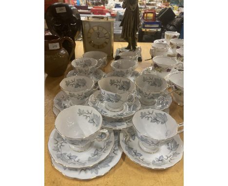 A QUANTITY OF ROYAL ALBERT CUPS, SAUCERS, SIDE PLATES PLUS A SUGAR BOWL AND CREAM JUG 