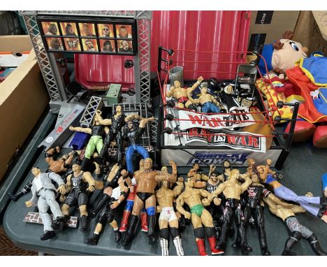 A LARGE QUANTITY OF WWE FIGURES, A WWE RAW WRESTLING RING AND VARIOUS OTHER ACCESSORIES 