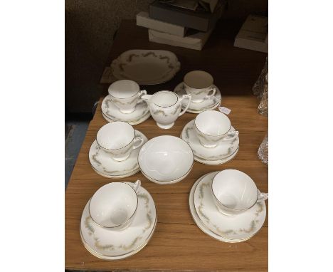 A COALPORT CHINA TEASET TO INCLUDE A CAKE PLATE, CREAM JUG, SUGAR BOWL, CUPS, SAUCERS AND SIDE PLATES 