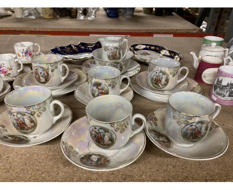 A CONTINENTAL STYLE LUSTREWARE TEA SERVICE WITH CLASSICAL DECORATION TO INCLUDE CUPS, SAUCERS, CREAM JUG, SUGAR BOWL, PALTES,