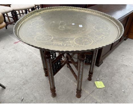 A BASS TOP TABLE WITH EGYPTIAN IMAGES ON, 28.5" DIAMETER, FOLDING TURNED BASE PROFUSELY INLAID WITH MOTHER OF PEARL 