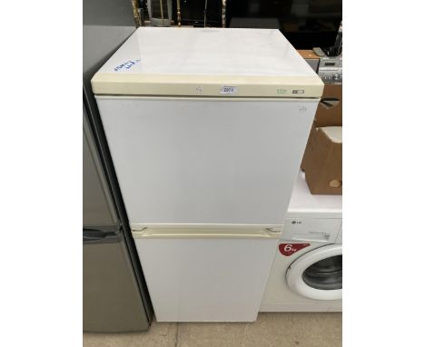 A WHITE TRIDENT UPRIGHT FRIDGE FREEZER 