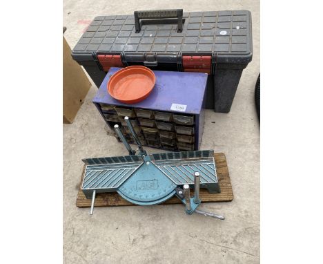 AN ASSORTMENT OF TOOLS TO INCLUDE A MITRE SAW AND A MULTIDRAWER STORAGE UNIT ETC 