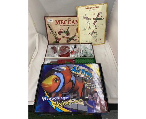 A VINTAGE MECCANO CONSTRUCTION SET AND REMOTE CONTROL AIR FLYING CLOWN FISH 
