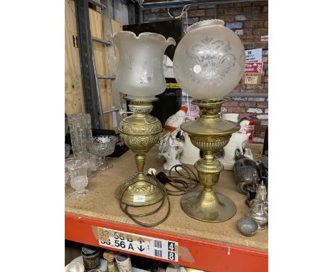 TWO VINTAGE BRASS OIL LAMPS WITH ETCHED GLASS SHADES - ONE HAS BEEN CONVERTED TO ELECTRICITY 