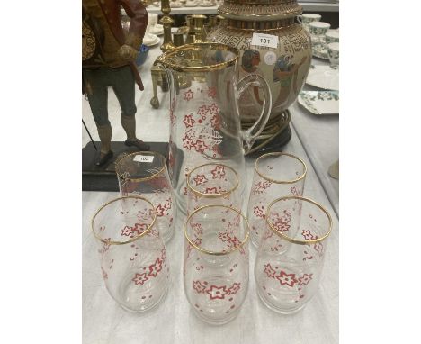 A VINTAGE LEMONADE SET TO INCLUDE A JUG AND SIX TUMBLERS DECORATED WITH RED AND WHITE FLOWERS 