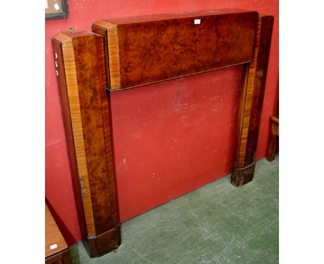 An Art Deco burr walnut and mahogany fire surround 