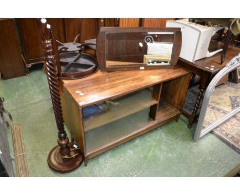 A 1960's oak low bookcase cabinet with sliding glass doors; a barley twist standard lamp; a 1960's oak wall mirror; a small m