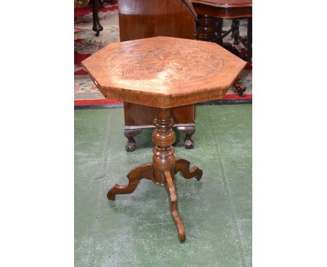 A 19th century Maltese walnut and marquetry octagonal tripod centre table, the top profusely inlaid with a stylised star moti