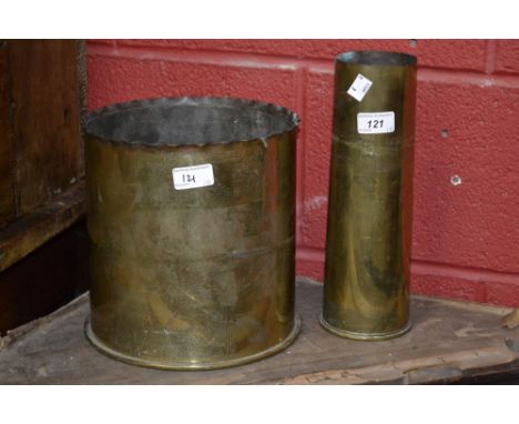 A large trench art brass vase; another, smaller; a soldier's belt, tools; etc.