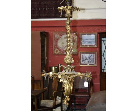 A Rococo style gilt metal six-light ceiling electrolier, wrythen column, cast throughout with scrolls and acanthus, 85cm high