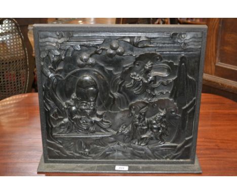 A Chinese rectangular hardwood panel, carved in relief with a scene from mythology, 40cm high, 43cm wide, early 20th century,