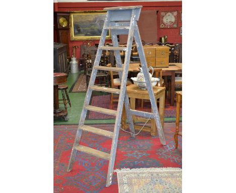 A set of vintage pine step ladders 