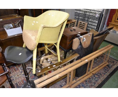 A Lloyd Loom style bedroom chair, with conforming footstool; 1950's oak workbox; a kitchen stool; a 1980's oak armchair frame