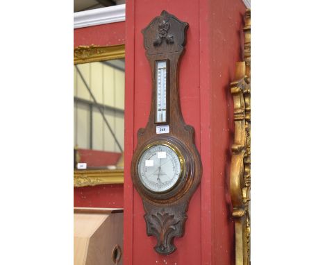 An oak banjo barometer, J.H.Steward, London