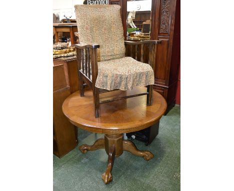 An early 20th century oak reclining armchair; a contemporary oak pedestal dining table; a pine book shelf. (3)