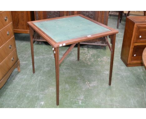 An Edwardian mahogany and inlay card table 