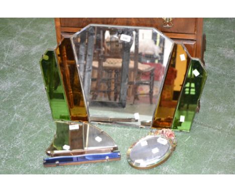 An Art Deco coloured glass wall mirror; a similar yacht mirror; another (3)