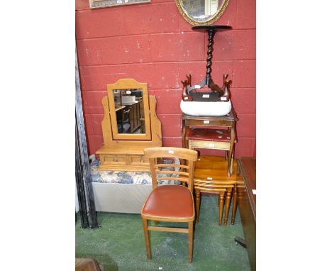 A Lloyd loom style ottoman; a reproduction wine table; a nest of three tables; a footstool; a wall mirror; a pine dressing mi