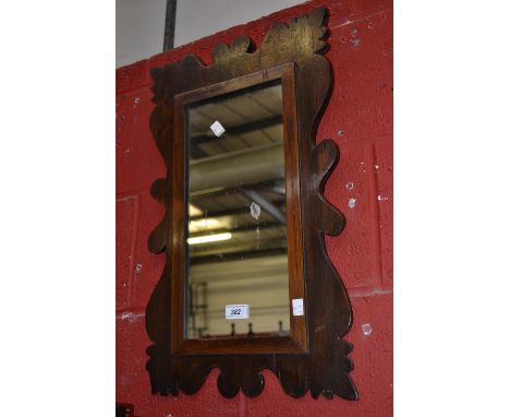 A Vauxhall type oak stained wall mirror, early 20th century