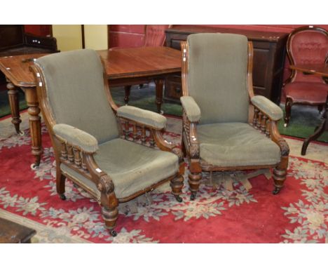A pair of Victorian Gentleman's and Ladies arm chairs, scroll back, turned supports, turned legs, ceramic casters, c1870