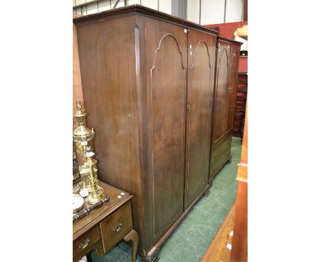 A mid 20th century three piece walnut veneered bedroom suite comprising double wardrobe; another; dressing table and stool.