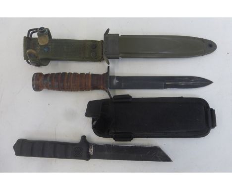 A U.S. Army M8A1 knife in its scabbard with a blade length of approximately 6 5/8" together with another knife in its scabbar