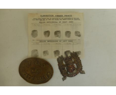 A Hampshire Police helmet badge (no fixings) with a brass Field Watchman badge and an original set of police elimination fing
