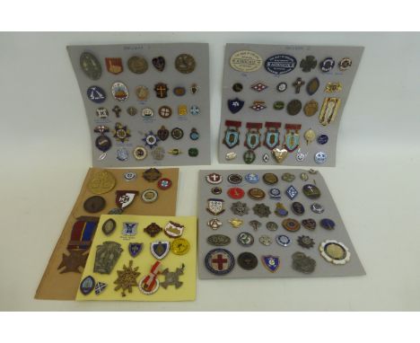 Five cards displaying an assortment of early 20th Century and later badges, including enamel, mainly of religious subjects, a
