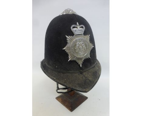 A Lancashire Constabulary police helmet with badge, size 7 1/2.