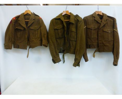 Three British Army battle dress jackets dated 1951, 1961 and one undated.