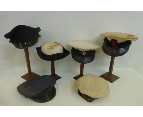 Six British Red Cross, army and navy caps and hats.