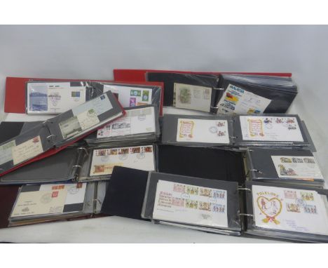 Nine albums of assorted First Day Covers, of various ages and topics, including world.
