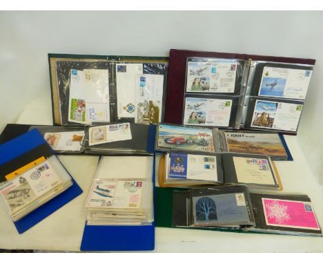 A box of eight folders of first day covers including one of army, navy and air force.