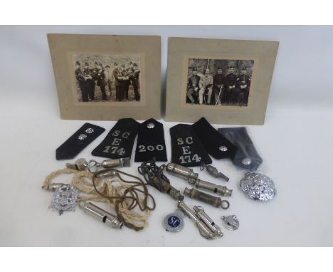Two Victorian police officer photographs mounted on board, approximately 9 3/4 x 7 3/4", with a quantity of whistles, epaulet