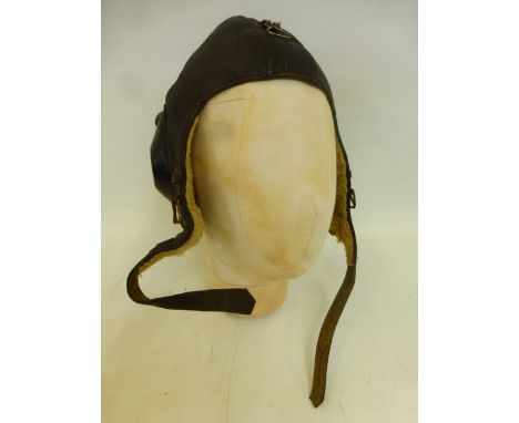 A leather airman's helmet with label for Striegel & Wagner.