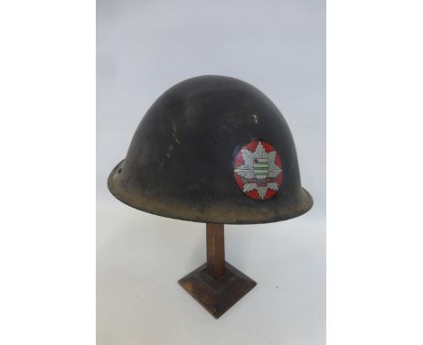 A Wiltshire Fire Brigade metal helmet with liner and chin strap.