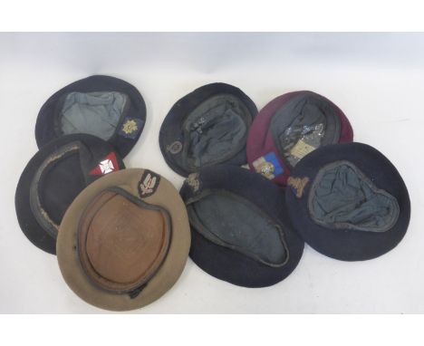 Seven British Army berets with badges including the S.A.S., Blues and Royals, Royal Artillery, R.E.M.E., Corps of Signals, et