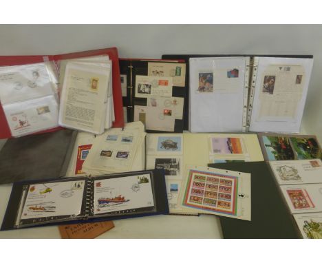A box of assorted first day covers and postcard albums, on various subjects.