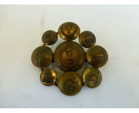 A unique trench art brooch made from various military buttons, to the centre a Royal Army Medical Corps button, surrounded by