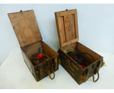 Two wooden ammunition boxes with contents, including trench art, brass shell cases, etc.