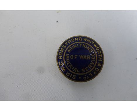 A WWI Armstrong Whitworth Munitions Imperial Service of War gilt and enamel lapel badge approximately 1" diameter, numbered 5
