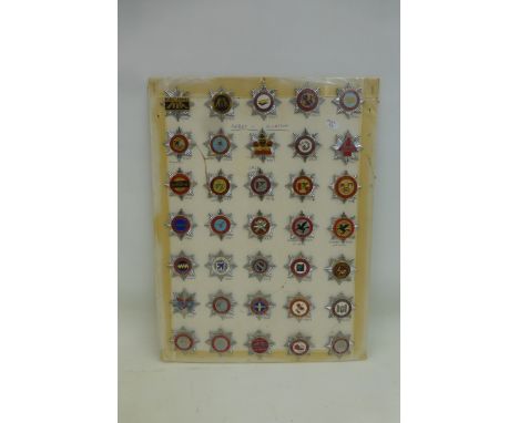  A display of 35 Airport & Aviation Fire Brigade chrome and enamel badges, average size 1 3/4" x 1 3/4". All retain their lug