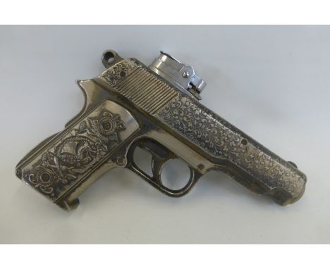 A novelty cigarette lighter in the form of an automatic pistol, approximately 6" long.