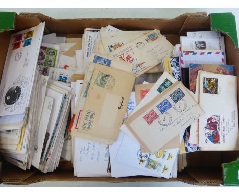 A box of assorted world first day covers and postmarks (unsorted).