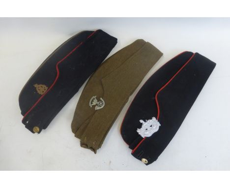 Three side caps for the Somerset Light Infantry, the Gloucestershire Regiment and the Royal Army Ordnance Corps.