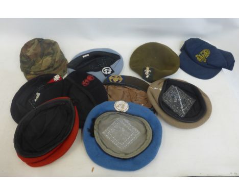 A box of ten assorted military berets and caps including Army Air Corps, R.E.M.E., Navy, Signals, D.E.R.R., U.N., etc.