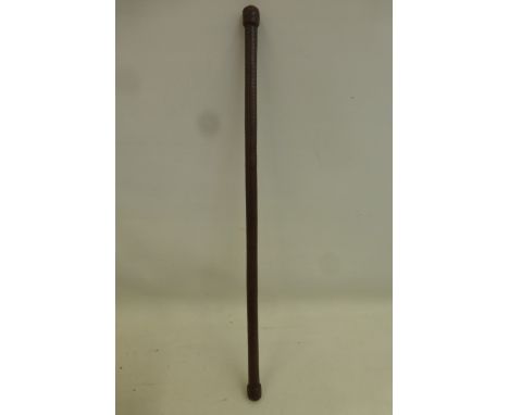 A leather covered wood swagger stick approximately 24" overall length.