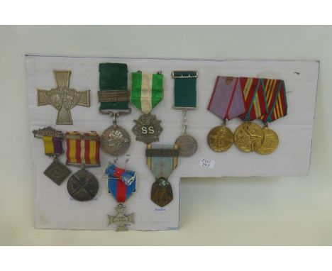 A display card of 11 British, Russian and French medals including the Red Cross, the Army Temperance Association, etc.